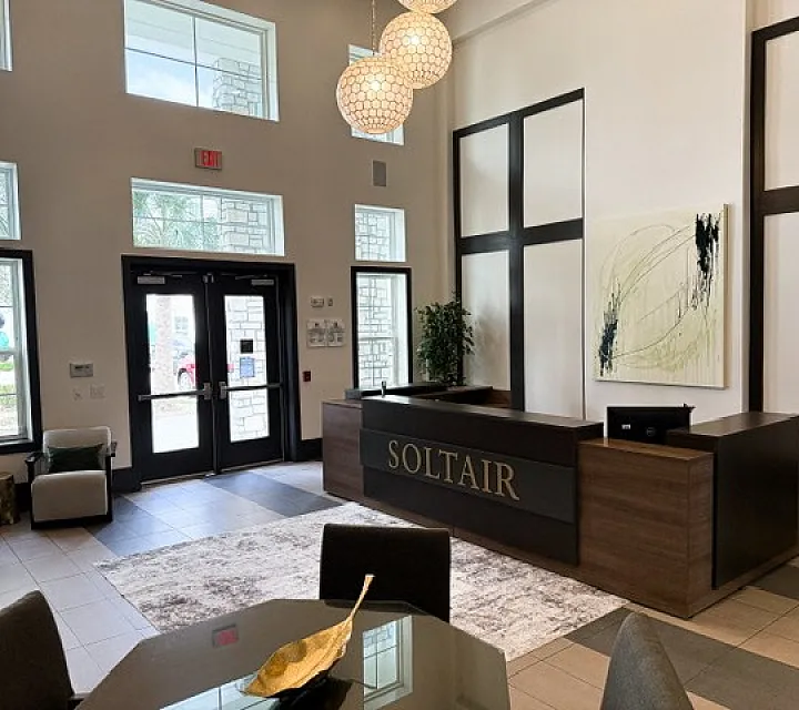 Elegant apartment lobby featuring modern design, tasteful decor, and a welcoming reception area at Soltair.