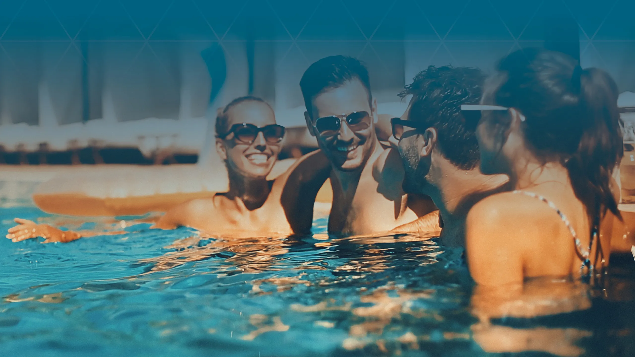 Vibrant lifestyle at a luxury apartment complex featuring a group of friends enjoying a refreshing pool under the sun.
