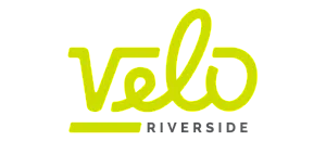 Vibrant and modern Velo Riverside logo, featuring sleek typography in bold lime green and clean design aesthetic.
