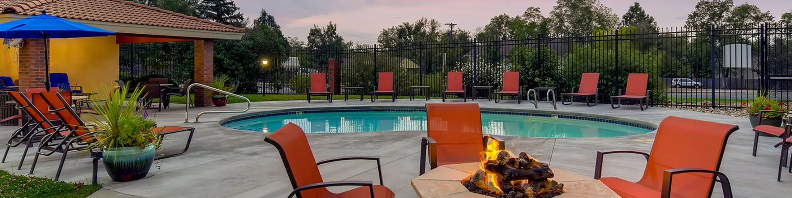 The Hills Apartments pool at dusk