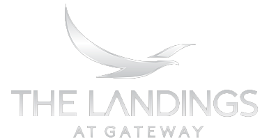 Sleek silver logo for The Landings at Gateway with a stylized bird design.