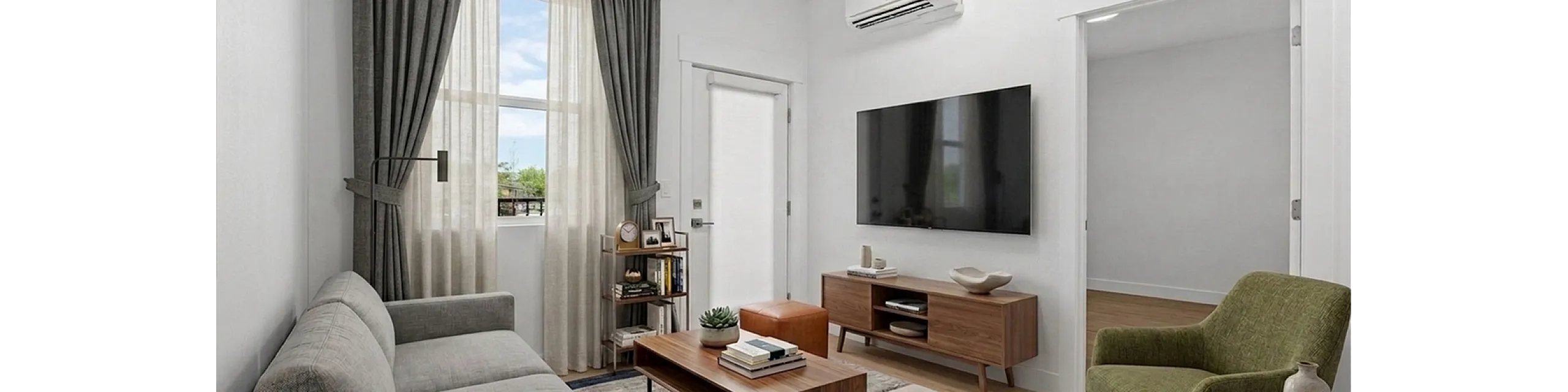 Modern living room with sleek gray sofa, wooden coffee table, and vibrant green armchair, featuring large wall-mounted TV and elegant floor-to-ceiling curtains.