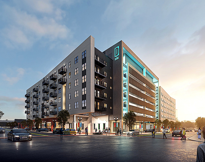 Stylish modern apartment building at sunset, featuring sleek balconies and vibrant street life.