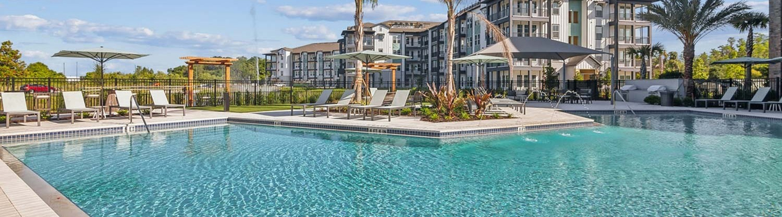 Resort-style pool with cabanas at RISE Sereno