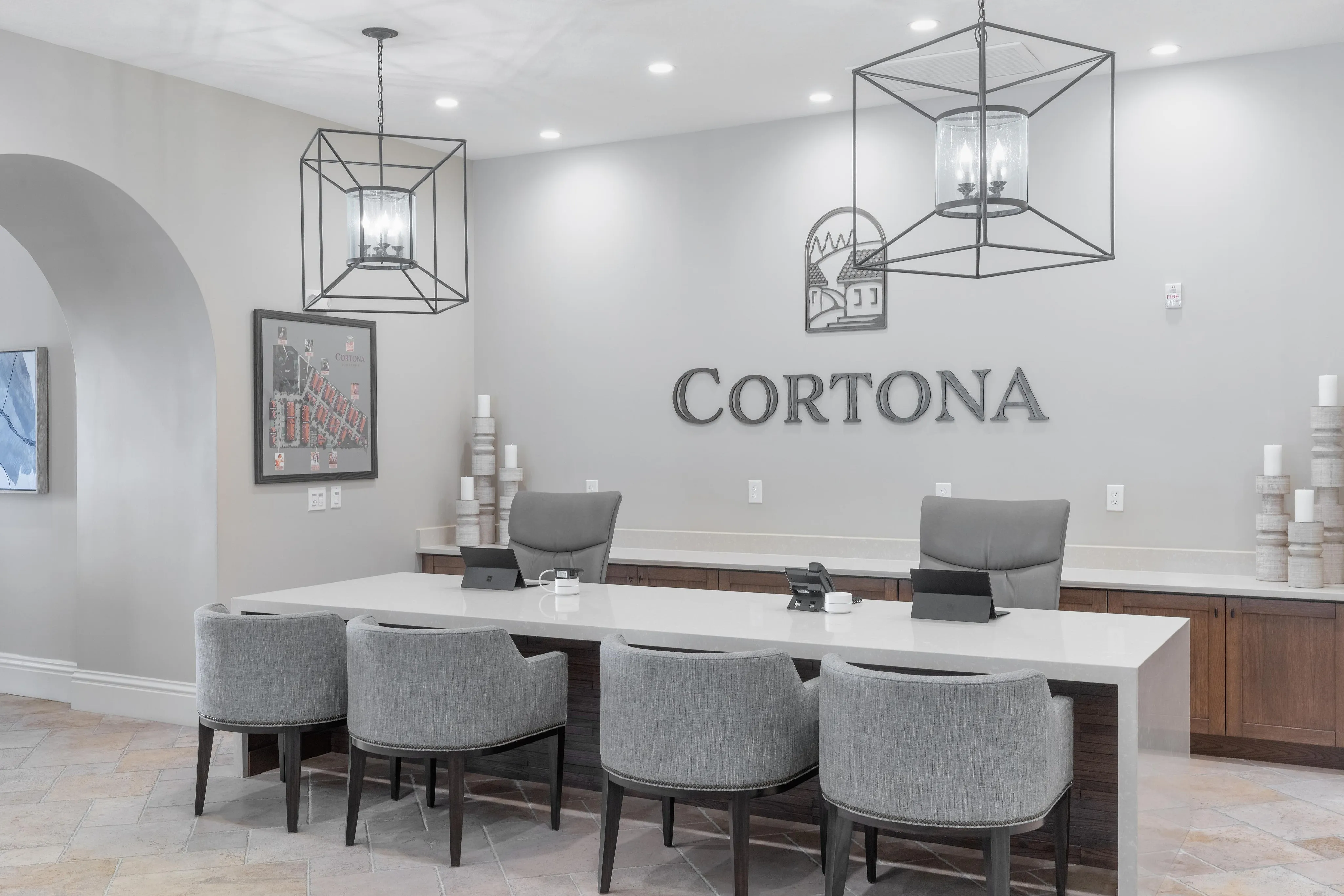 Luxurious reception area with modern lighting, chic seating, and stylish decor.