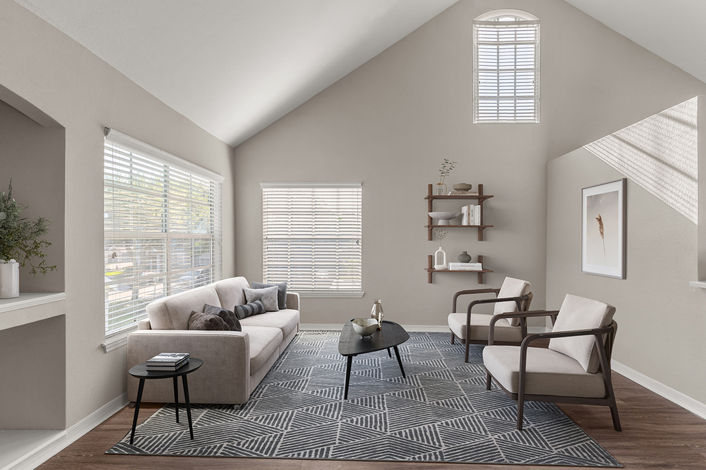 Bright and inviting living room with vaulted ceilings, modern furniture, and elegant decor.
