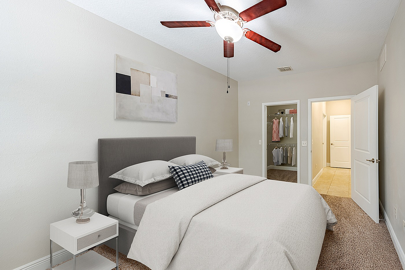 Inviting bedroom featuring a cozy bed, elegant decor, and a well-organized walk-in closet.