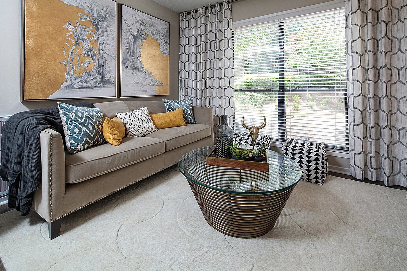 Chic living room with elegant sofa, vibrant cushions, and stylish decor, offering a cozy and inviting atmosphere.