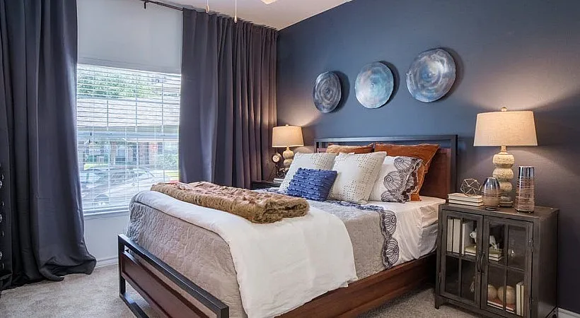 Inviting bedroom with stylish decor, cozy bedding, and elegant lighting, creating a warm and luxurious sanctuary.