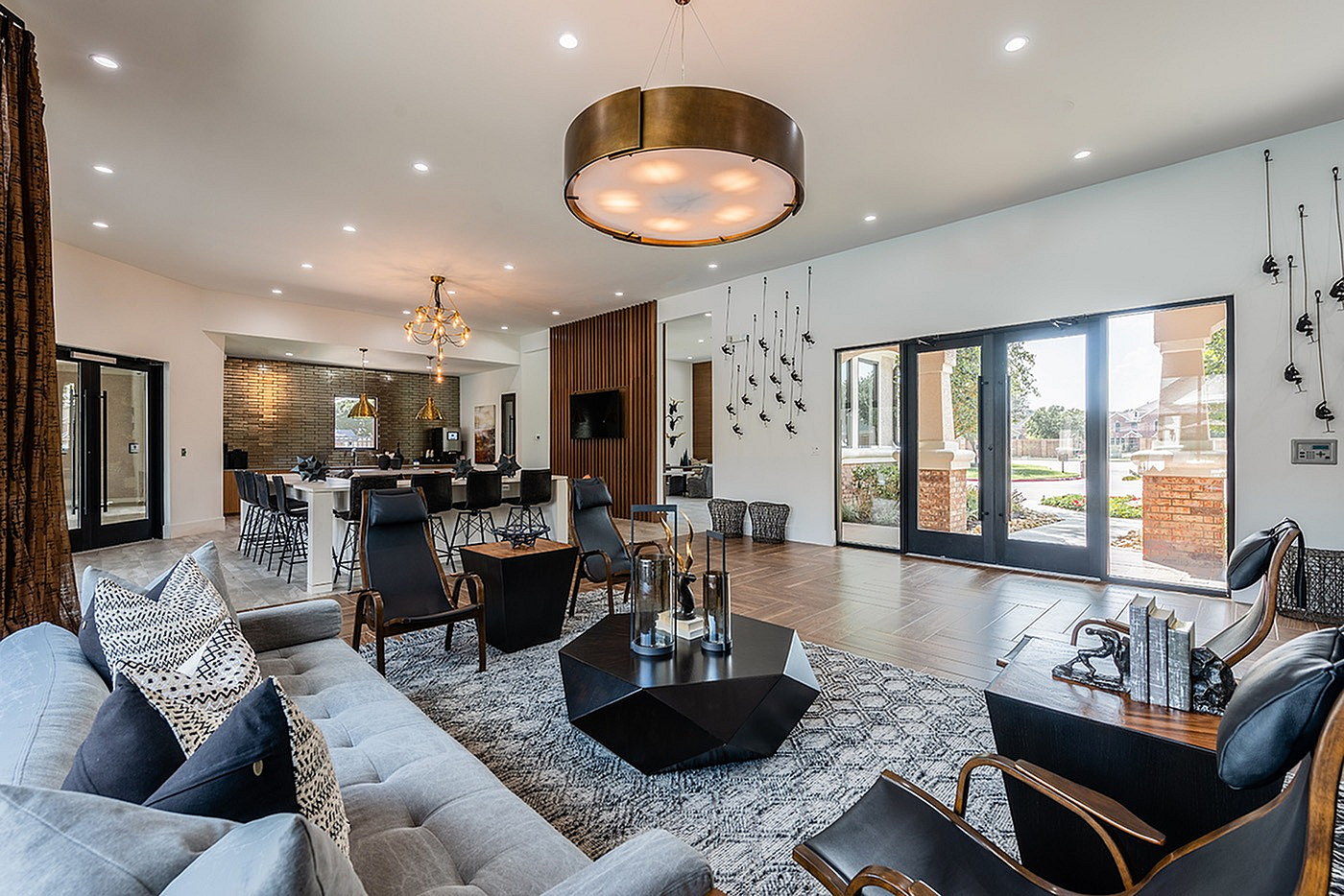 Elegant open living space with modern furnishings, large windows, and a cozy ambiance, perfect for relaxation and entertaining.