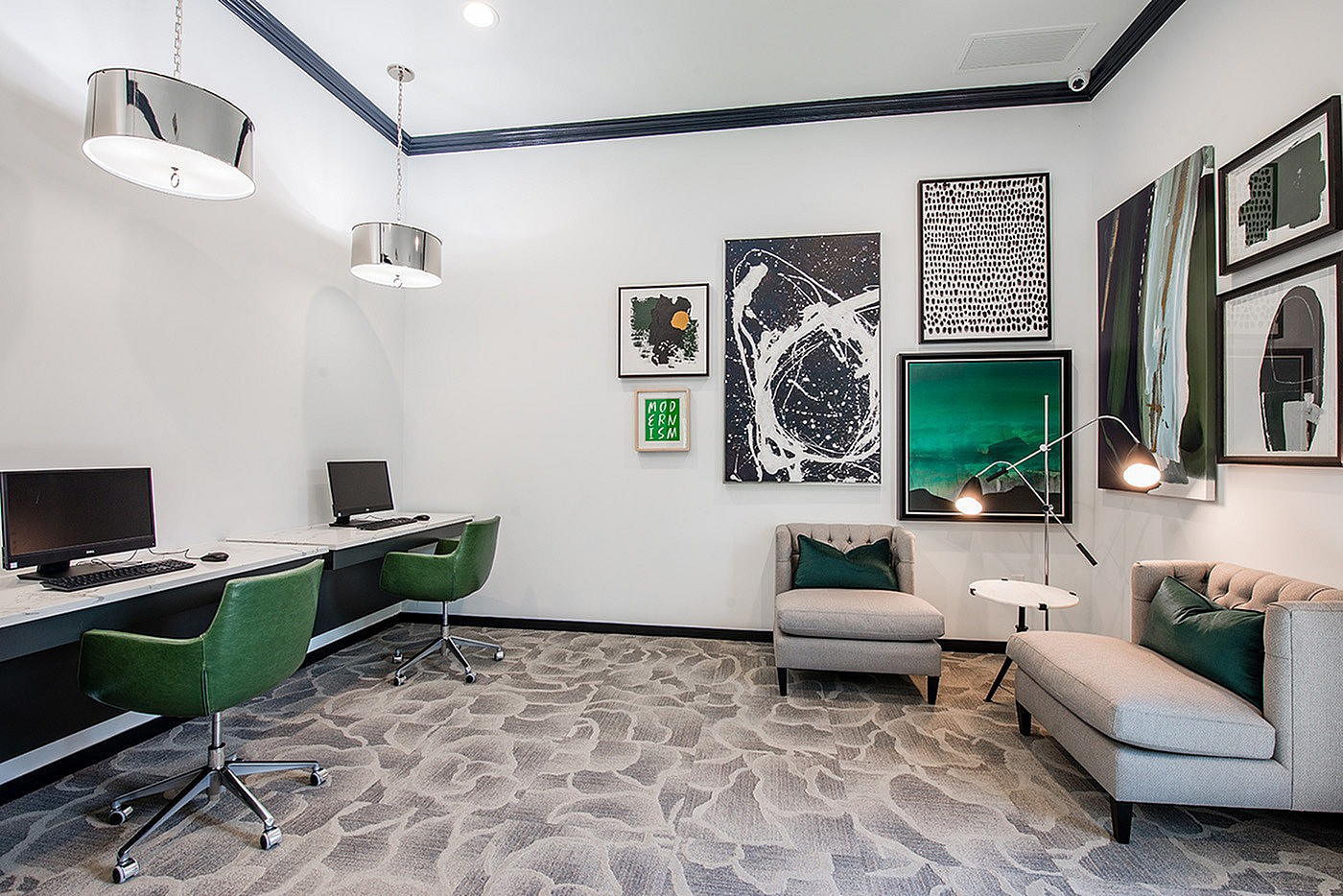Chic modern office space with sleek workstations, artistic decor, and cozy seating, featuring vibrant green accent chairs and stylish lighting.