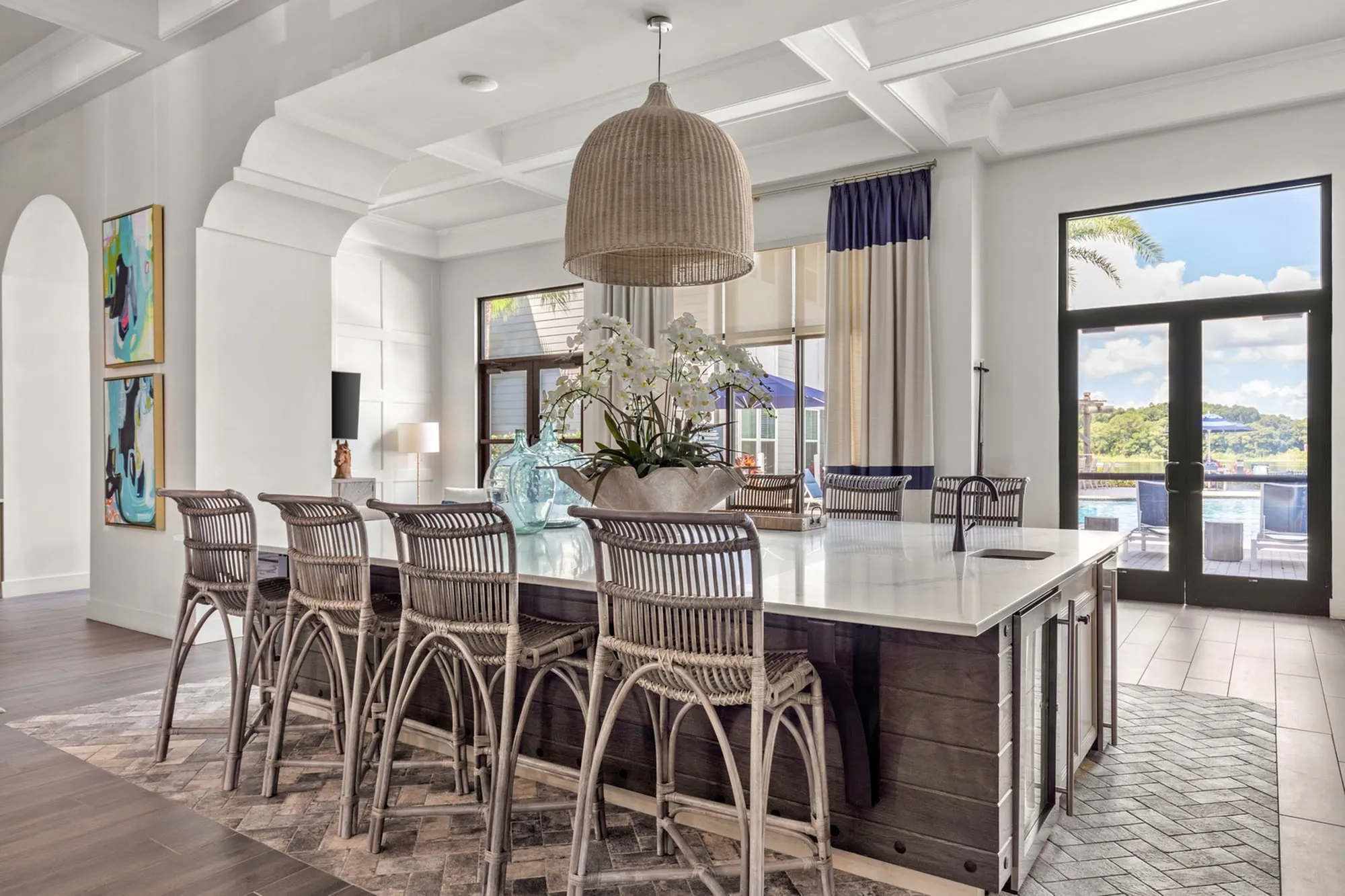 Indoor community area with a large table and chairs with floral decor