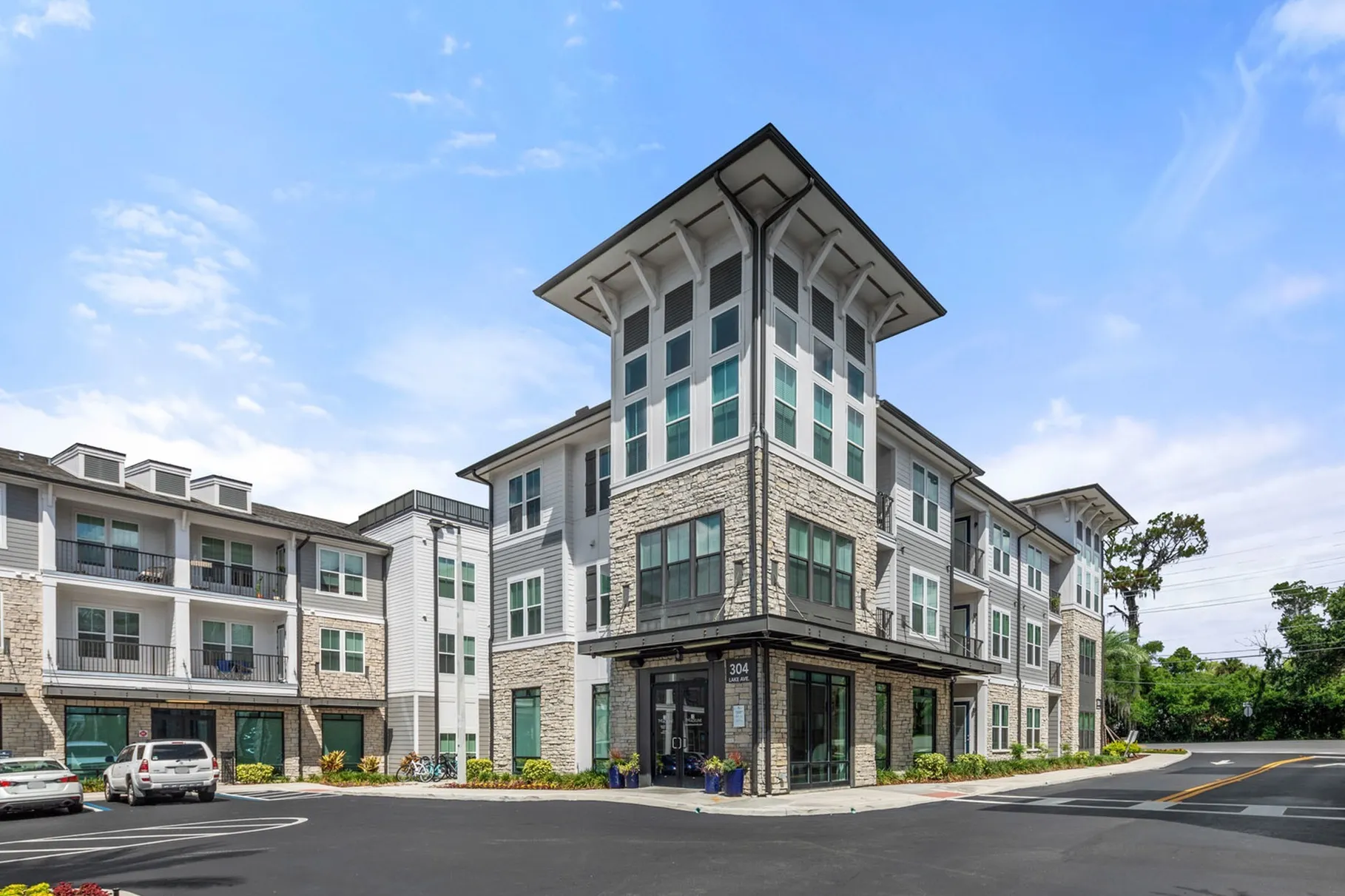 Exterior of apartment building with brick, balconies and glass doors