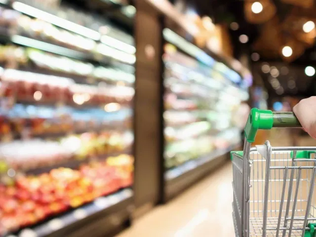 person pushing shopping cart