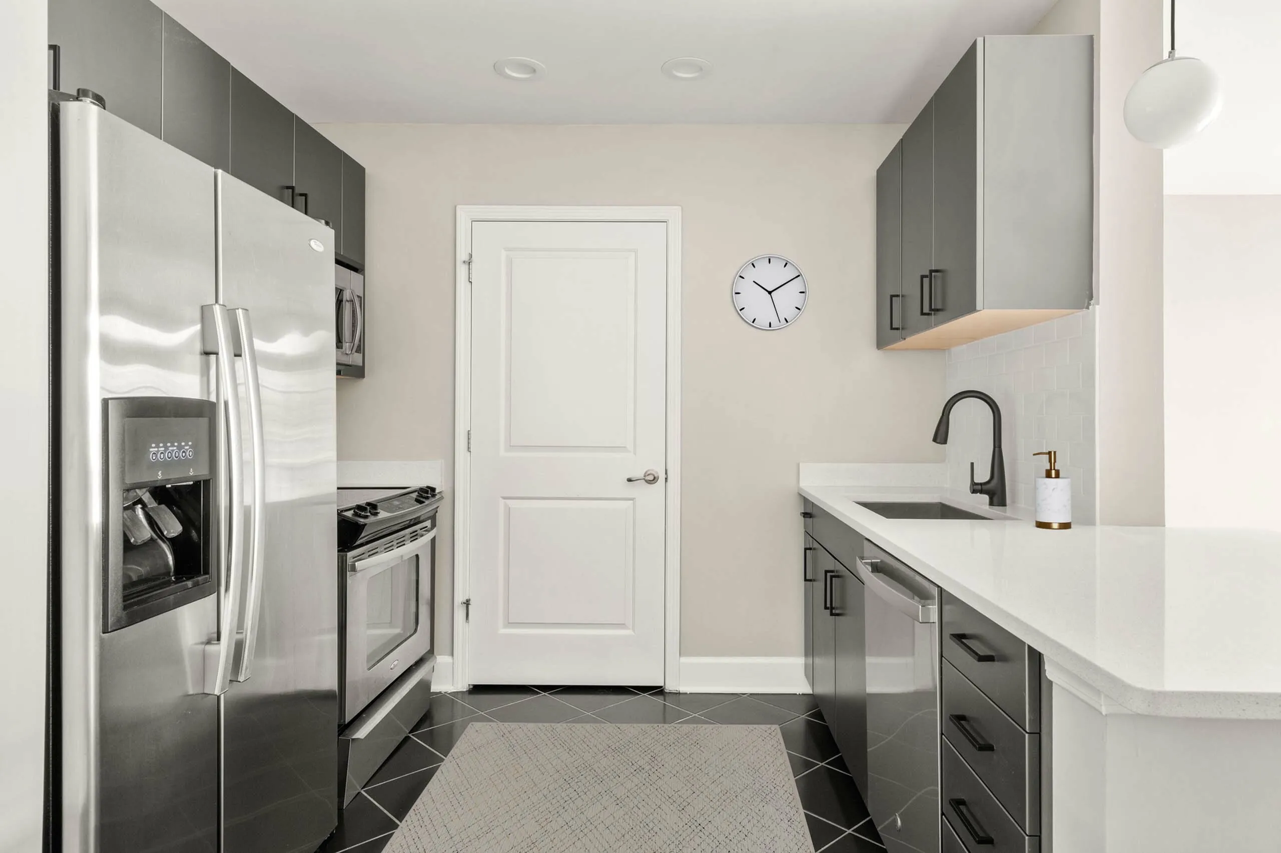 Modern kitchen with sleek stainless steel appliances, elegant cabinetry, and a stylish minimalist design.