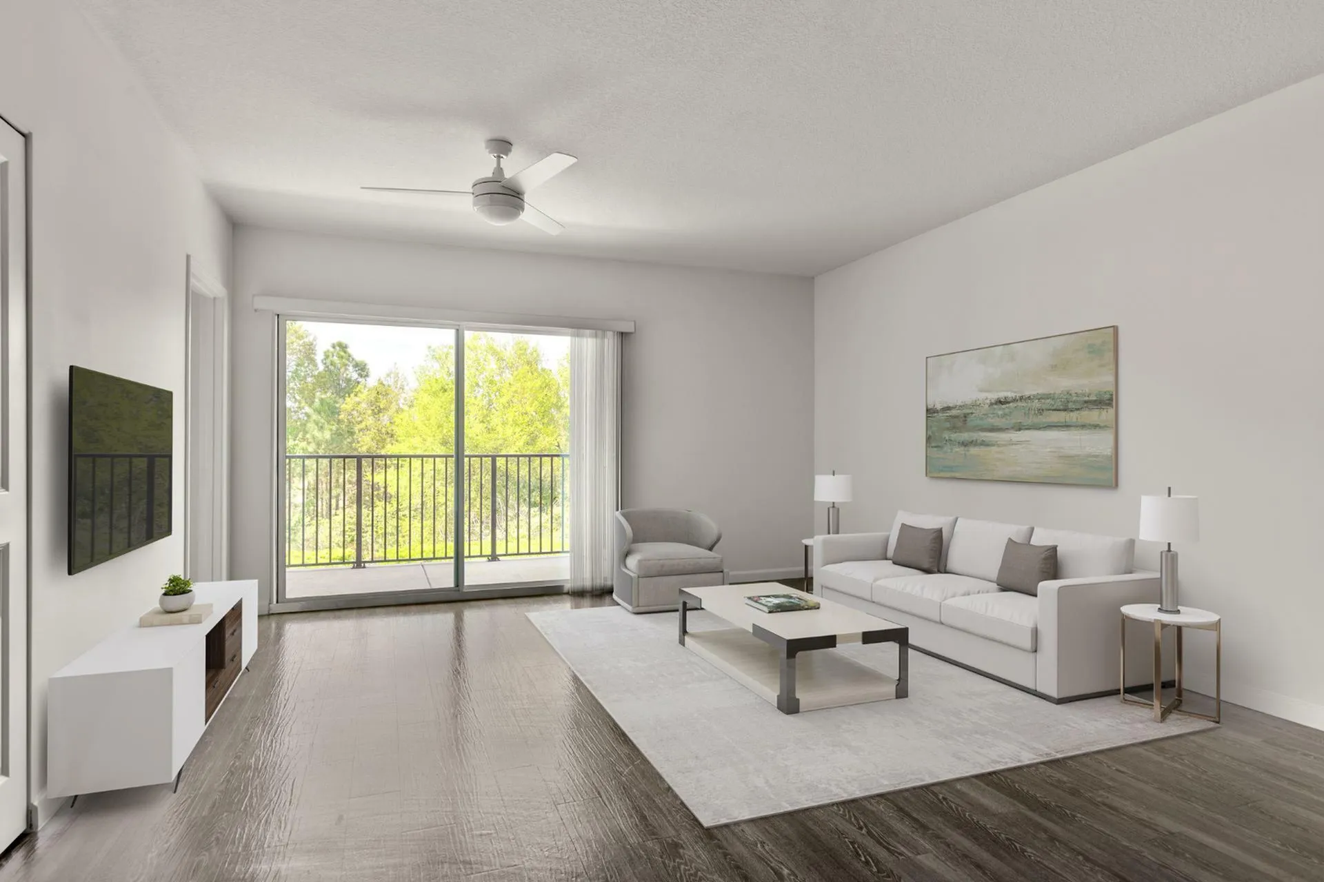Bright and inviting living room featuring modern decor, elegant wooden flooring, and a scenic view through large sliding glass doors.
