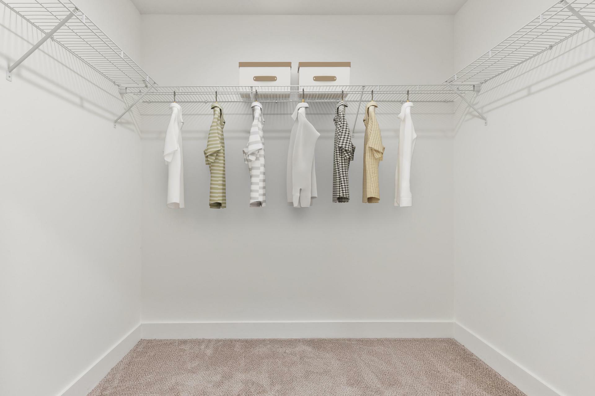 Spacious walk-in closet with organized shelving and hanging space, enhancing the appeal of modern apartment living.
