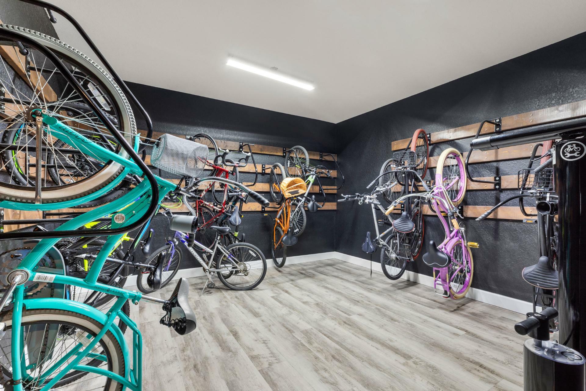 Modern bike storage room with sleek design, featuring multiple racks and vibrant bicycles, showcasing convenience and style.