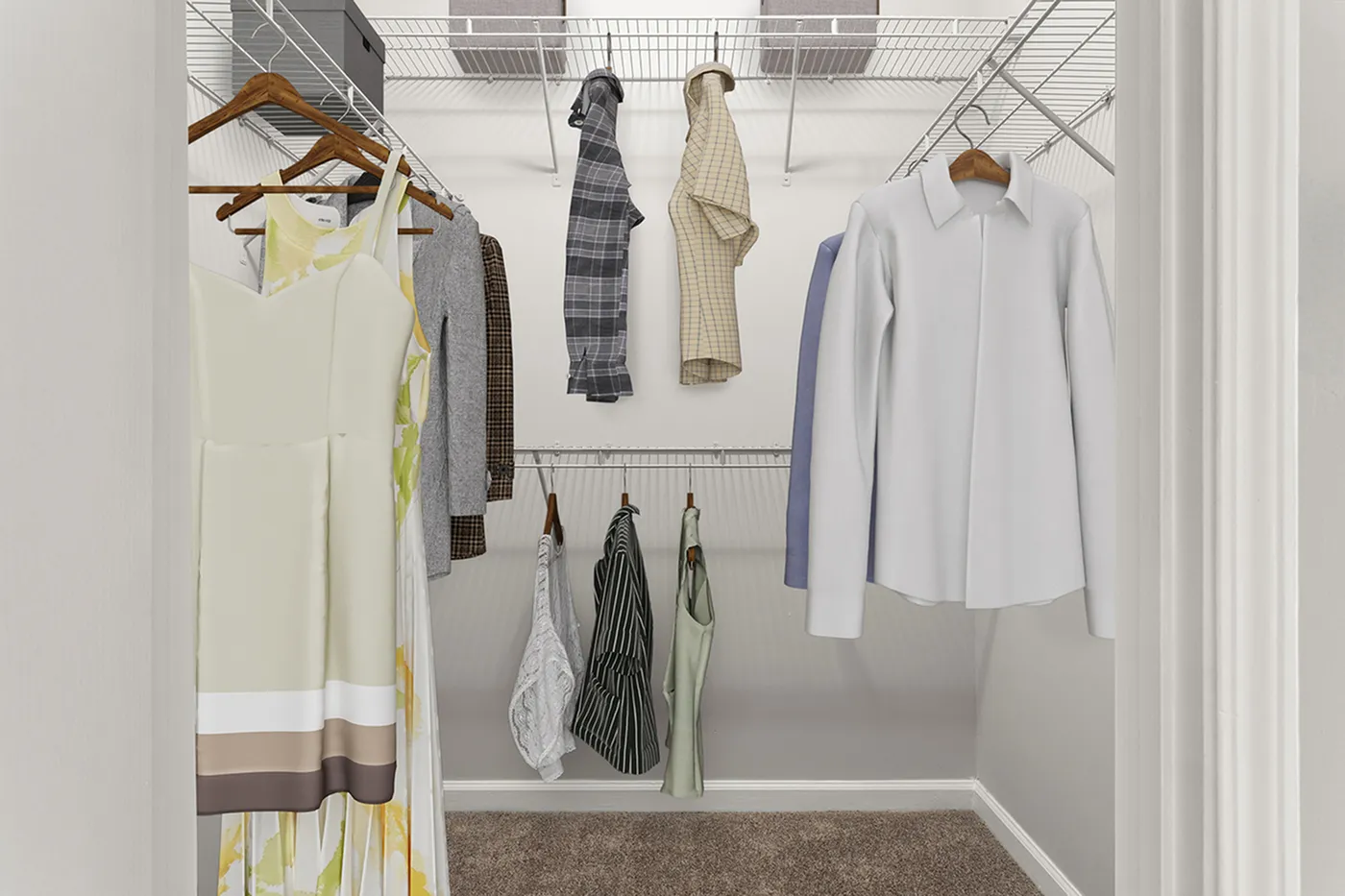 Spacious walk-in closet featuring sleek shelving and an array of stylish clothing, highlighting ample storage space and modern design.