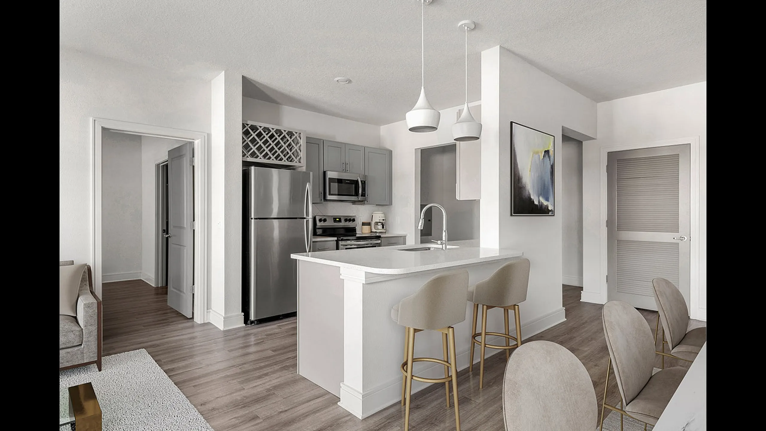 Elegant open-concept kitchen with modern stainless steel appliances, chic gray cabinets, and a stylish breakfast bar with pendant lighting.