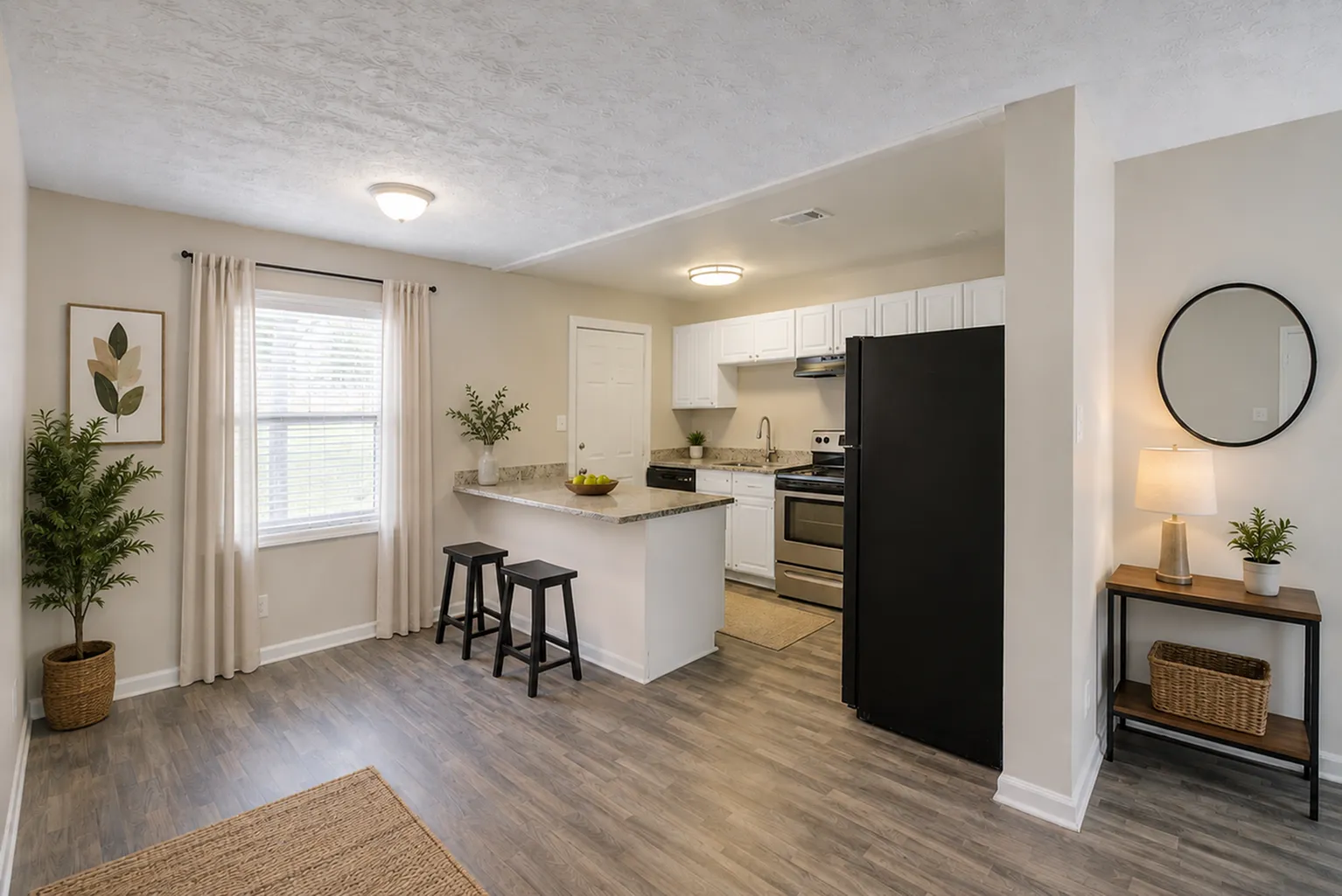 Bright and inviting kitchen with sleek appliances, stylish bar seating, and tasteful decor.