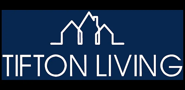 Elegant Tifton Living logo in a stylish navy blue design, featuring minimalist house outlines.
