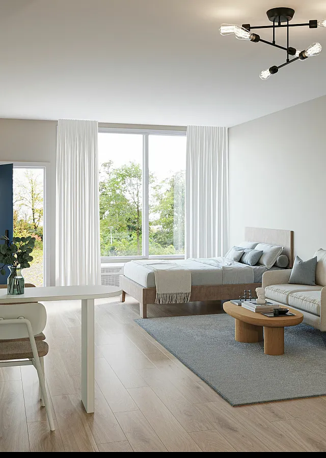 Bright and contemporary studio apartment with a cozy bed, elegant sofa, and airy window view. Featuring a modern chandelier and stylish decor.