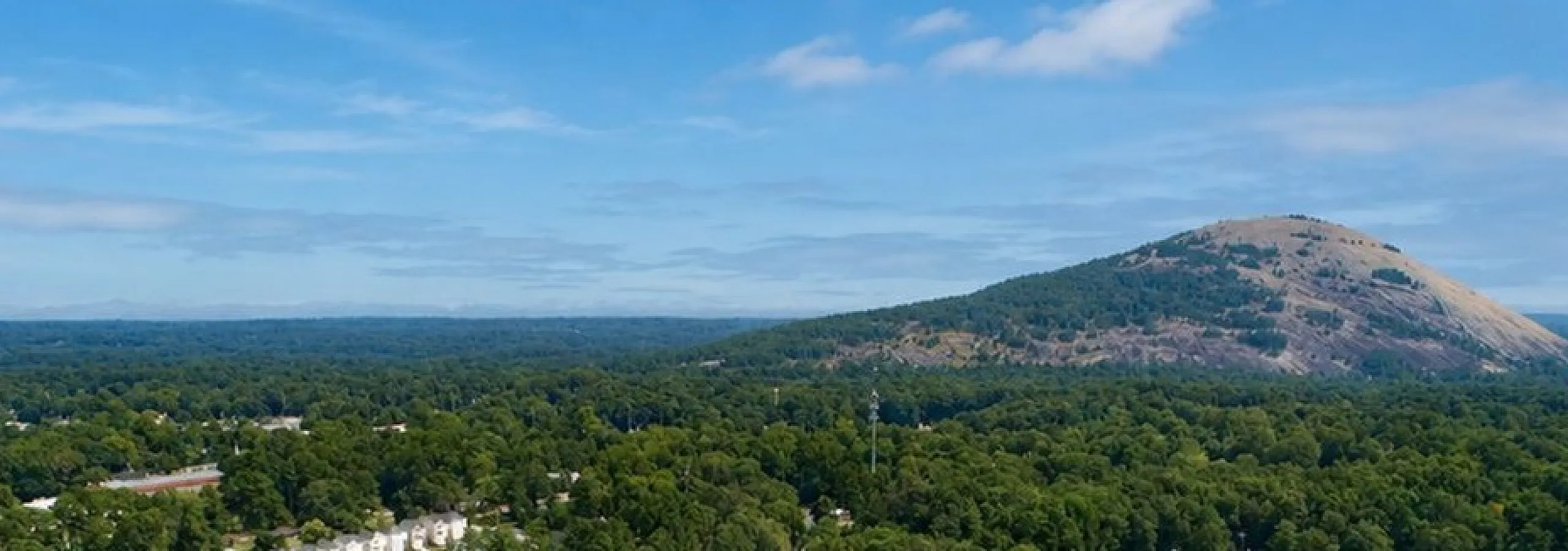 Charming suburban neighborhood with lush greenery, offering a serene setting and scenic mountain views.