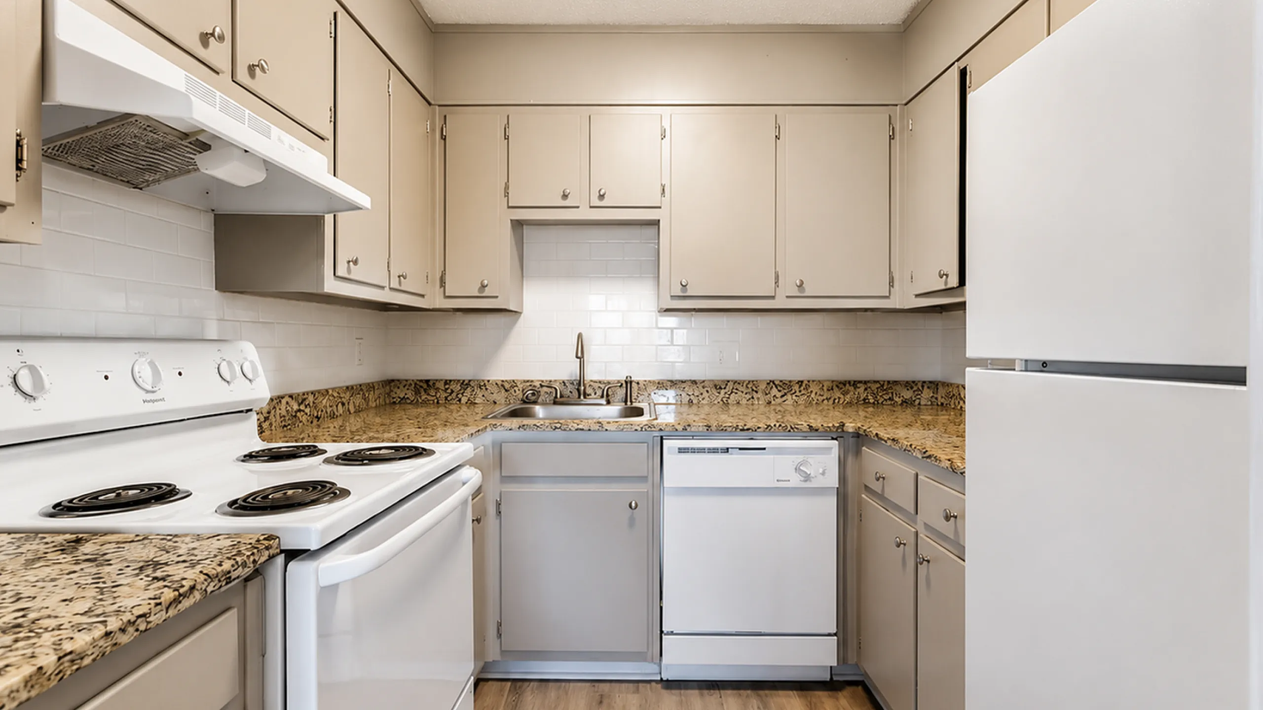 Charming kitchen with sleek cabinetry, granite countertops, and modern appliances for a perfect cooking experience.