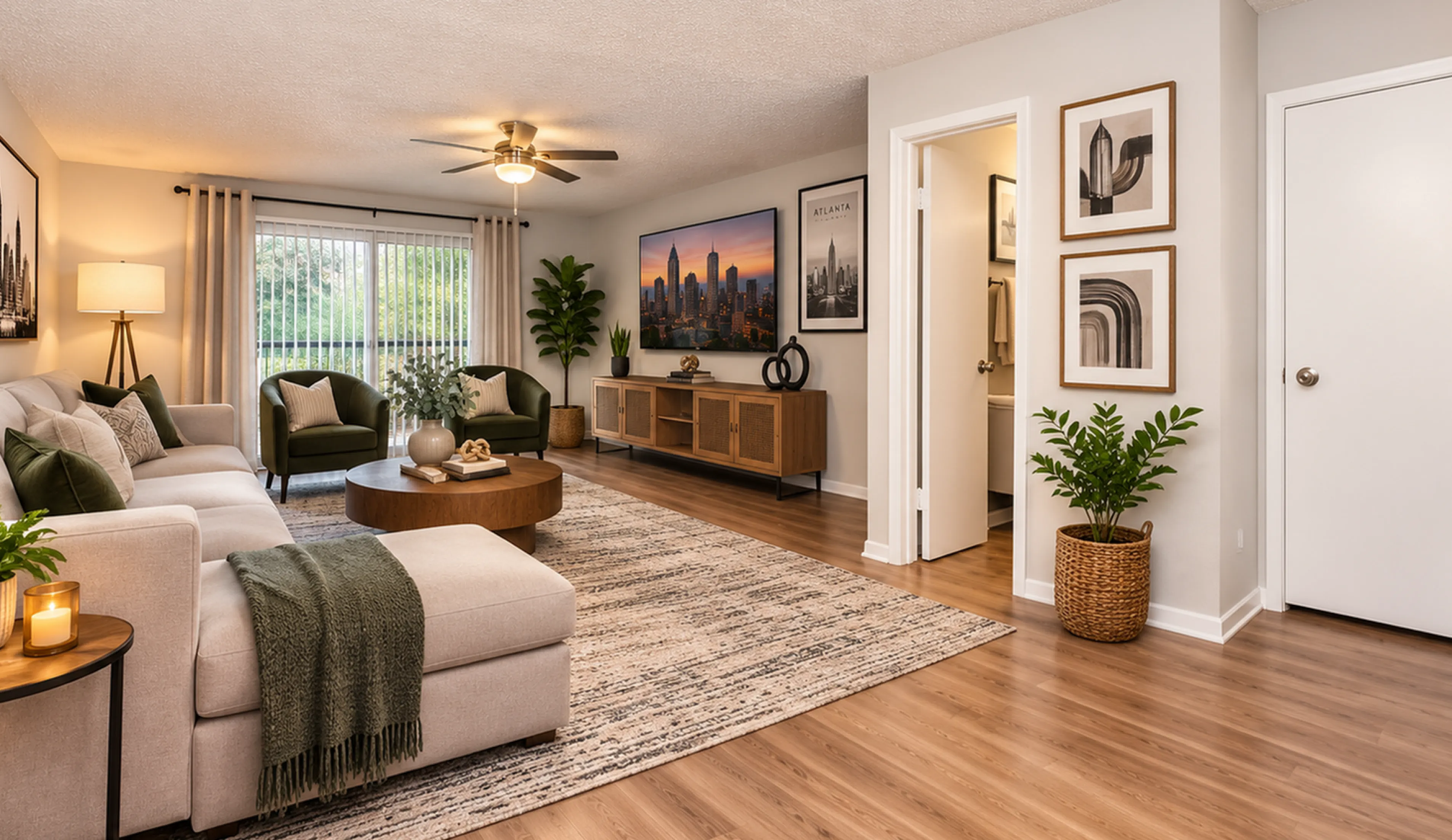 Contemporary living room with elegant decor, featuring a plush sectional sofa, stylish armchairs, and chic wall art. Abundant natural light highlights the modern flooring and cozy ambiance.