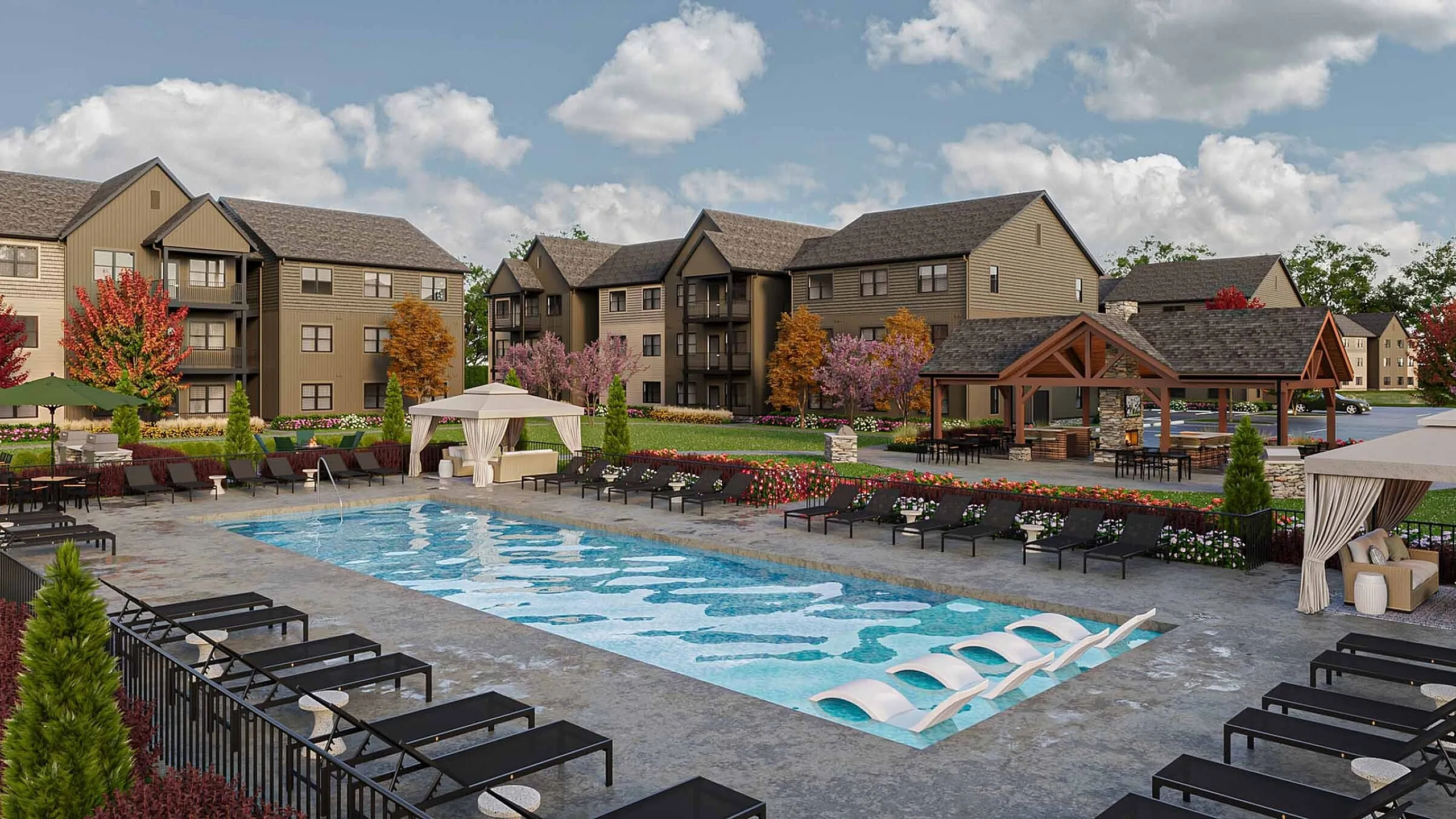 Luxurious apartment complex with a stunning outdoor pool, surrounded by cozy lounge areas and lush landscaping.