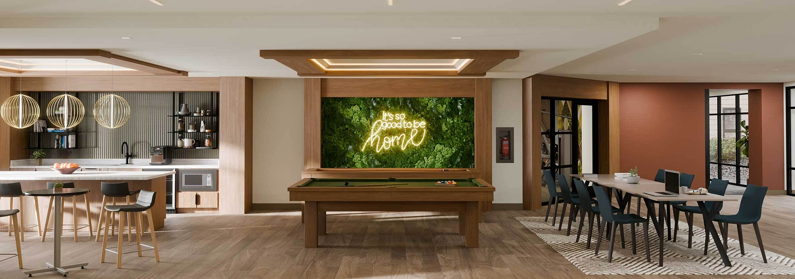 Elegant open-concept entertainment area featuring a modern kitchen with chic bar seating, illuminated pool table, and sophisticated dining space.