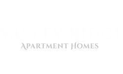 Valley Ridge Apartment Homes logo in elegant white font.