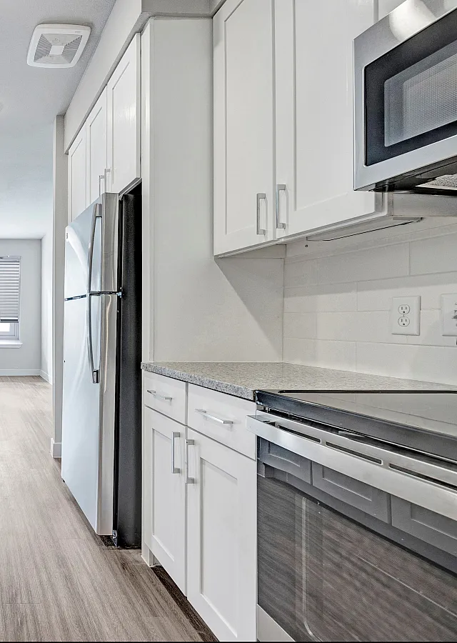 Modern kitchen with stainless steel appliances | Brightleaf at Lakeline Apartments
