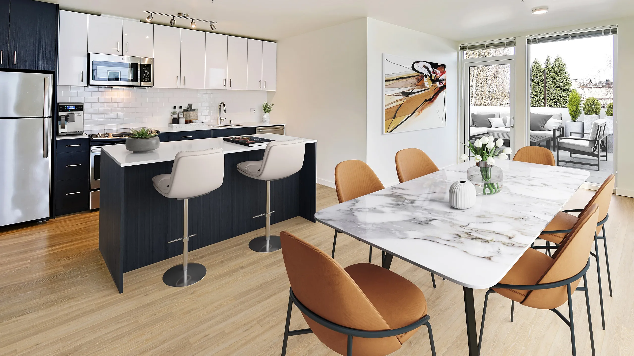 Modern open-concept kitchen and dining area with sleek cabinetry, marble dining table, and a sunlit balcony view, perfect for entertaining.