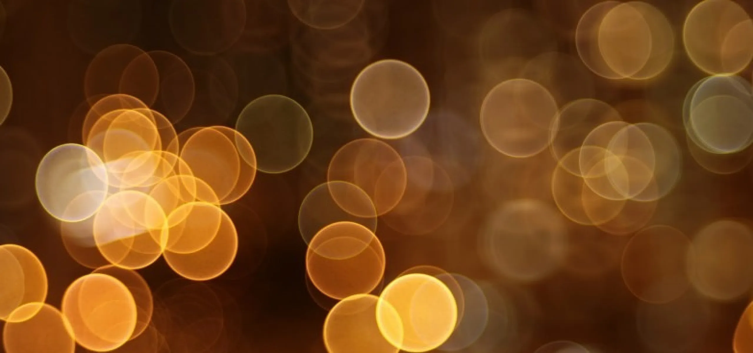 Enchanting display of golden bokeh lights creating a warm, inviting atmosphere.