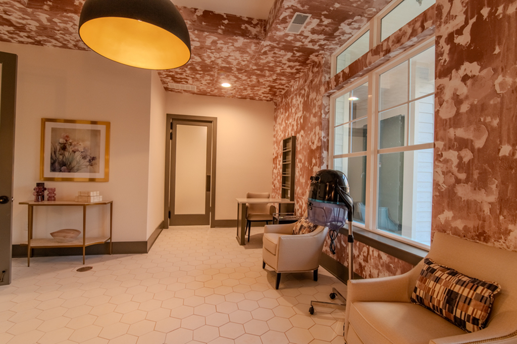 Inviting lounge area with elegant seating, large windows, and modern decor.