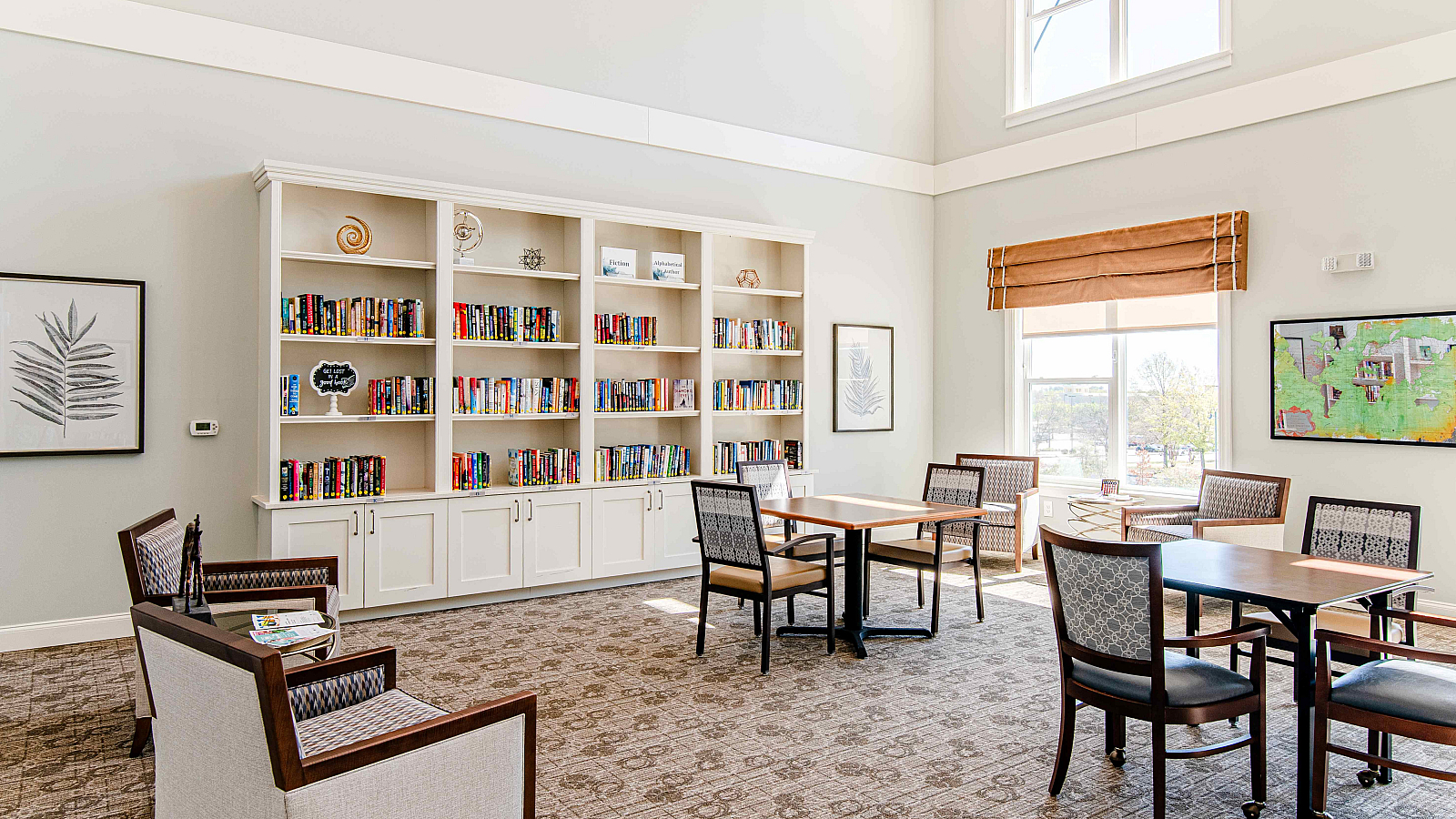 Inviting library space with elegant bookcases, comfortable seating, and abundant natural light.