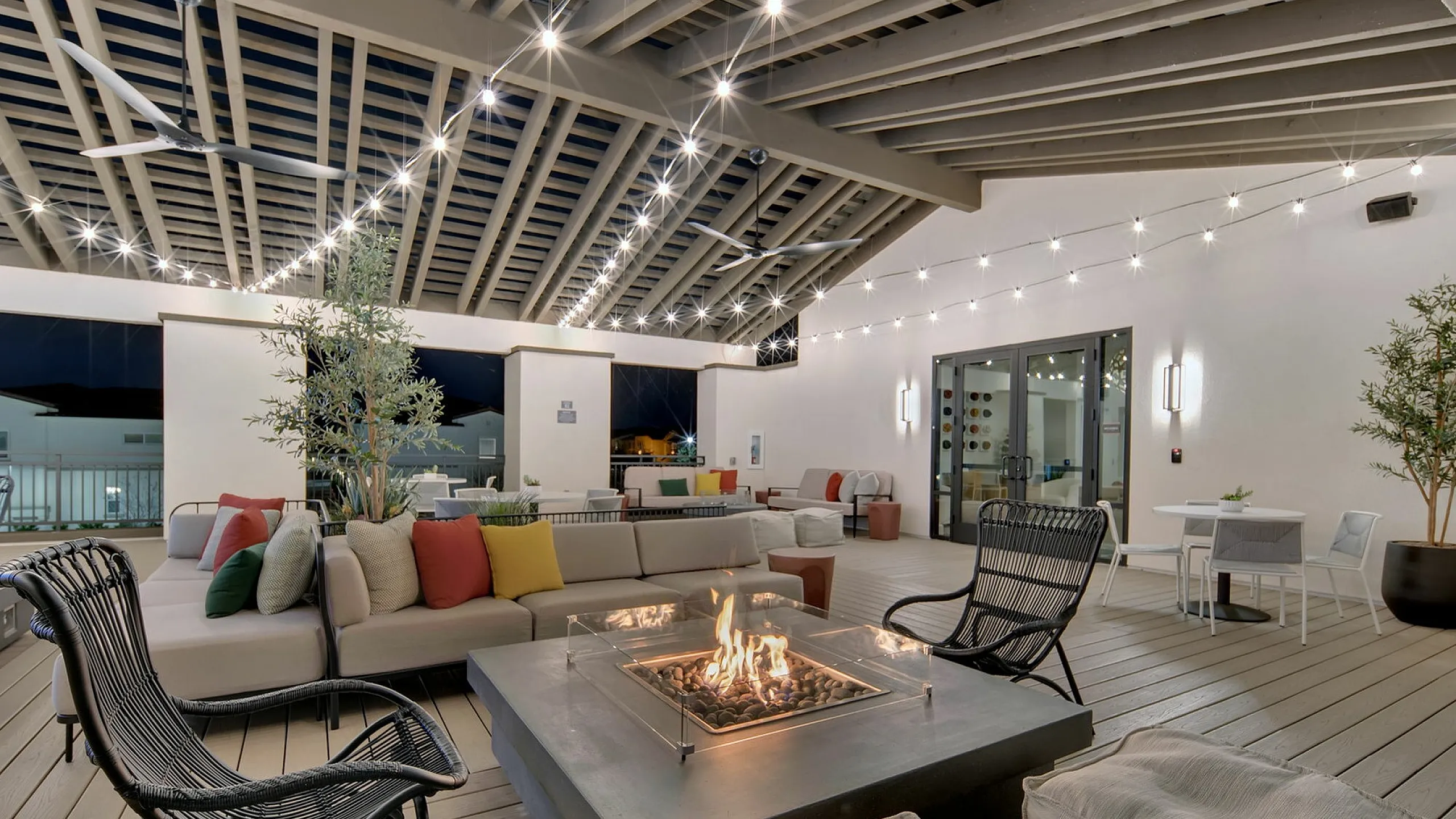 Clubhouse with comfortable chairs facing the pool
