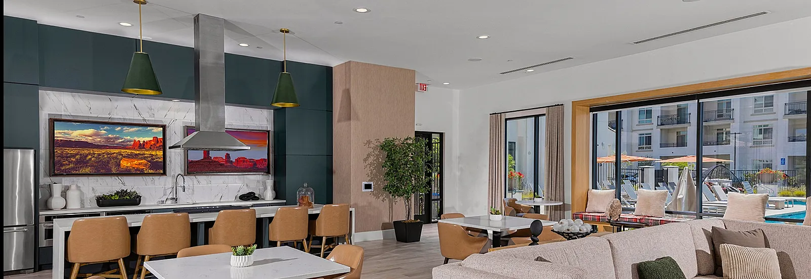 Modern open-concept clubhouse wifi area with plush seating, elegant dining space, stylish kitchen, and large windows overlooking a sunny courtyard.