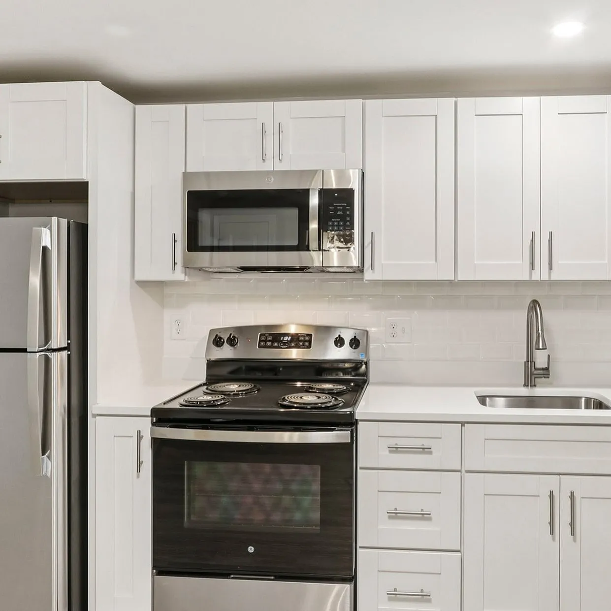 Kitchen sink in a Westgate Arms apartment with water, sewer, and trash removal included