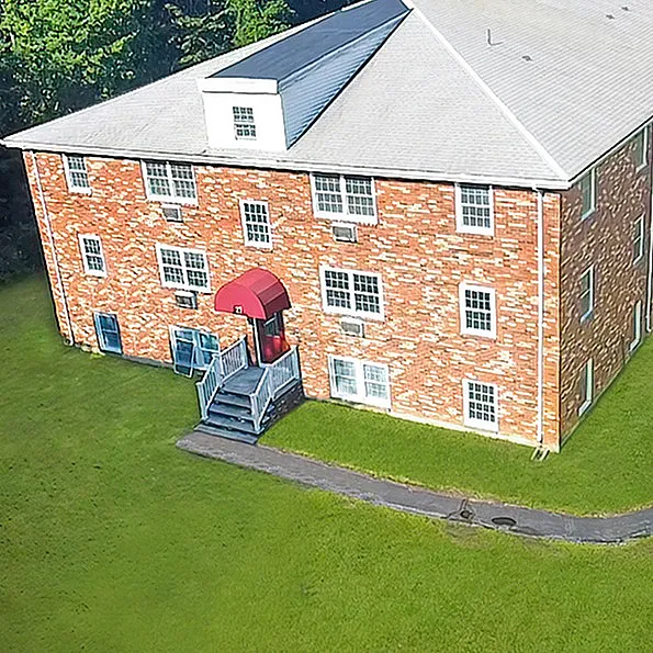 Historic brick apartment buildings at Westgate Arms in Salem, NH