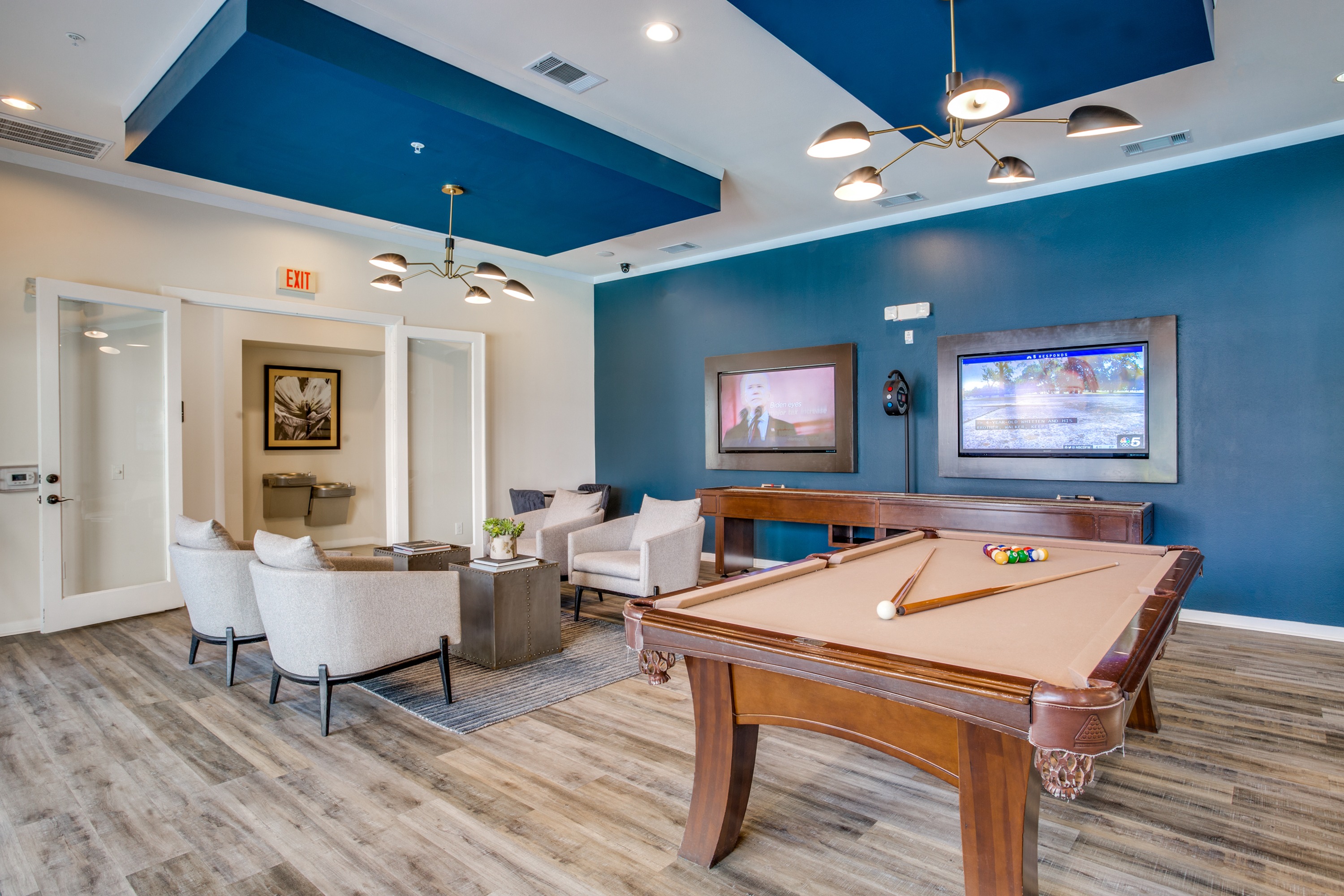 Billiards table in resident lounge with seating area and TV\'s