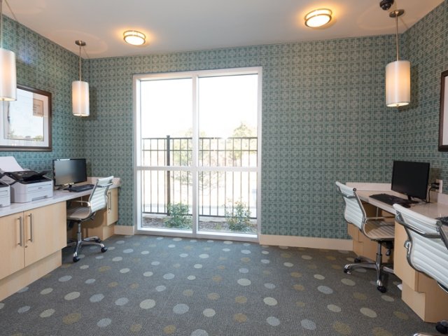 Residents Utilizing Business Center | Apartments for rent in Dallas, TX | Highpoint Senior Living