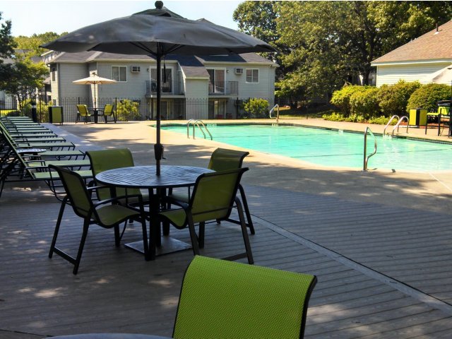 Residents Lounging by the Pool | Lowell MA Apartments For Rent | Cabot Crossing Apartments