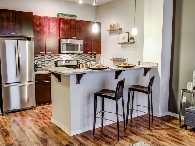 Image of Espresso-stained maple kitchen cabinetry and doors for The Paxon (Closed)