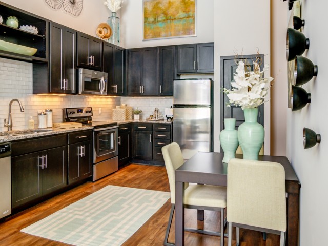 Image of Espresso-finish wood cabinetry in kitchens for The Flats at Taylor Place (Moved to RC)