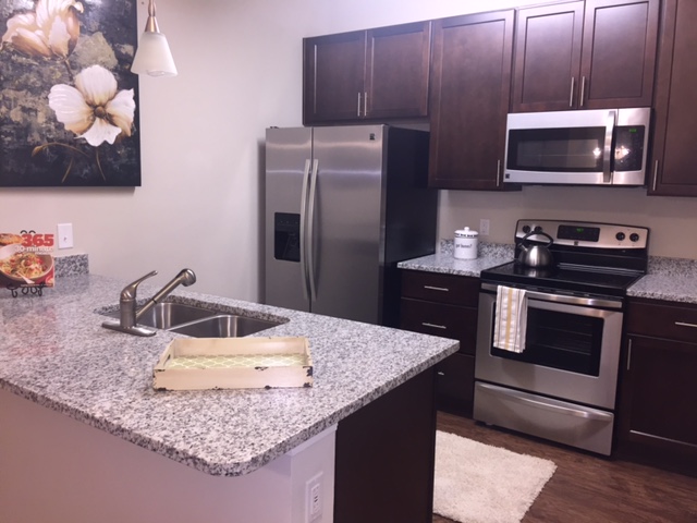 Kitchen with full appliance package and granite countertops l Monterey Pointe