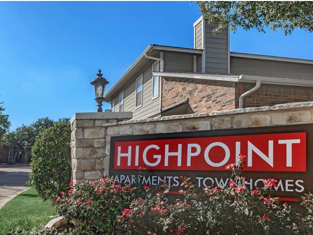 High Point Apartments entrance surrounded by beautiful landscaping