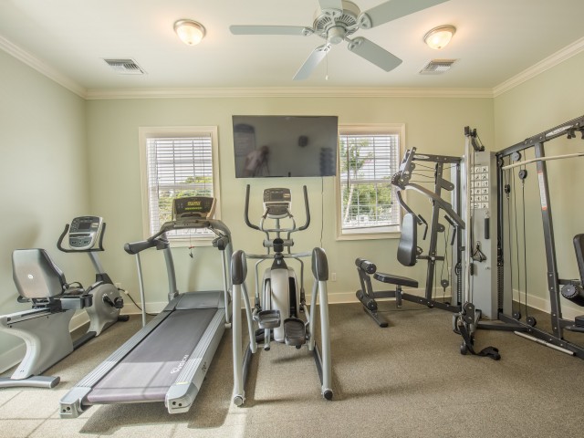 Fitness Center with stationary bike, treadmill, elliptical, and universal weight machine